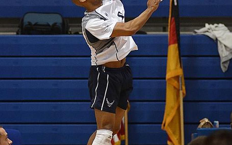 U.S. Air Forces in Europe volleyball team member Christopher Hucks spikes the ball during the 2012 NATO Allied Air Command volleyball championships, held this week at RAF Lakenheath, England. The men&#39;s team finished the tournament in third place and the women&#39;s team placed first.