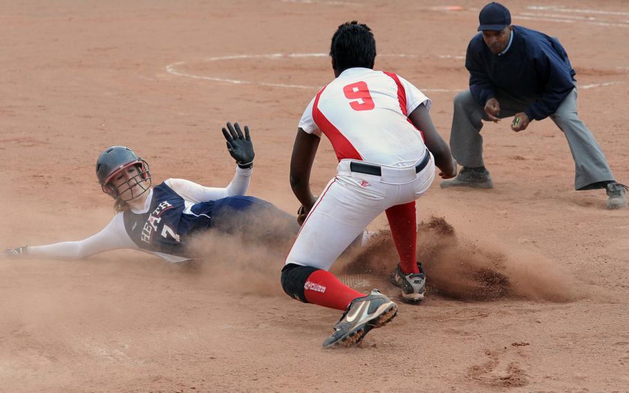 Lakenheath's Lexi Knupp slides safely in to third under Deyza Mason's tag in the second game of a doubleheader against Kaiserslautern, Friday in Kaiserslautern. The home team won both games.