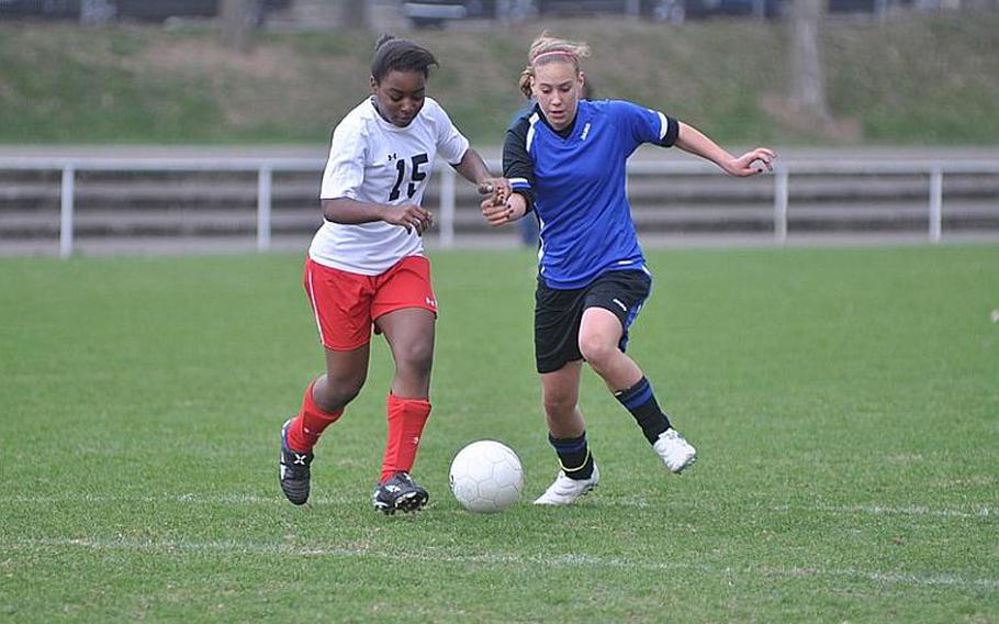 Bria Bredley of Schweinfurt, left, defends against Justice Moore of Hohenfels on Saturday. The Lady Razorbacks of Schweinfurt captured their first win of the season with a 5-1 victory over the visiting Lady Tigers.
