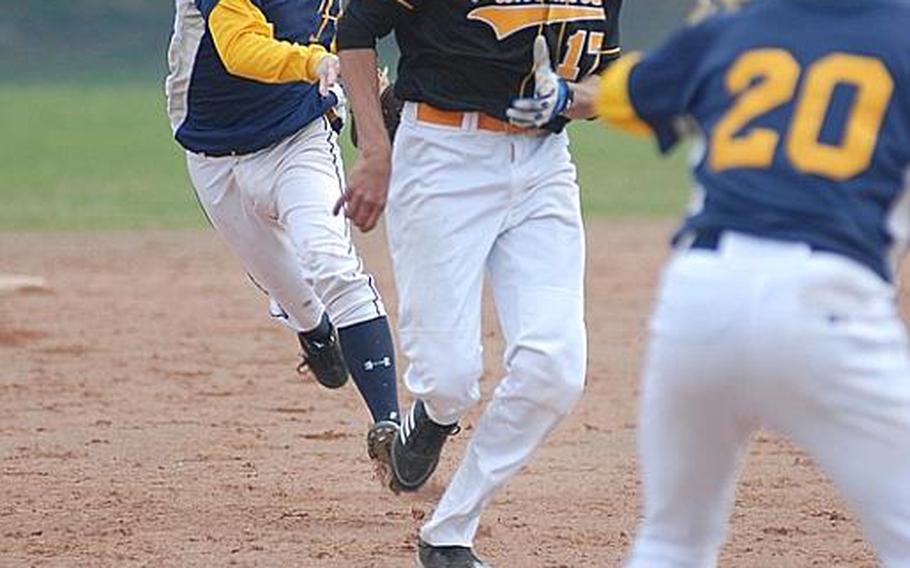 Heidelberg's Jacob Parsons, top, and Jimmy McBride put the squeeze on Patch baserunner Chris Cabrera Saturday at Heidelberg's Patrick Henry Village. The Panthers swept the Lions in close games.