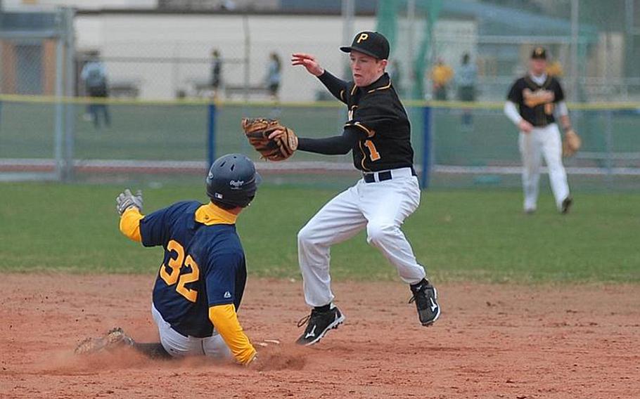 Heidelberg's Austin Benton tries to avoid the tag of Patch's Ross Wilson on Saturday during a doubleheader at Heidelberg. The Panthers won both games.