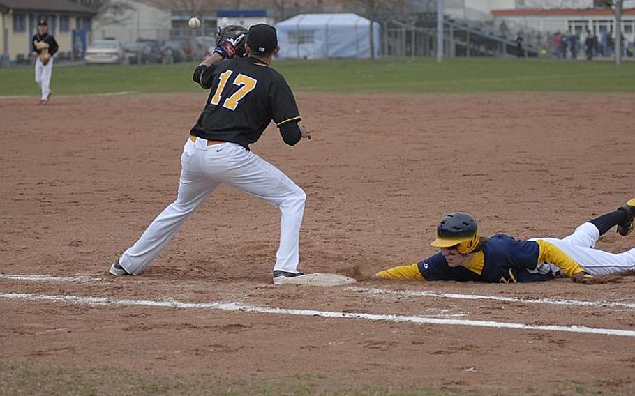 Heidelberg's Henry Dickson slides into first as Patch first baseman Chris Cabrera waits for the ball.