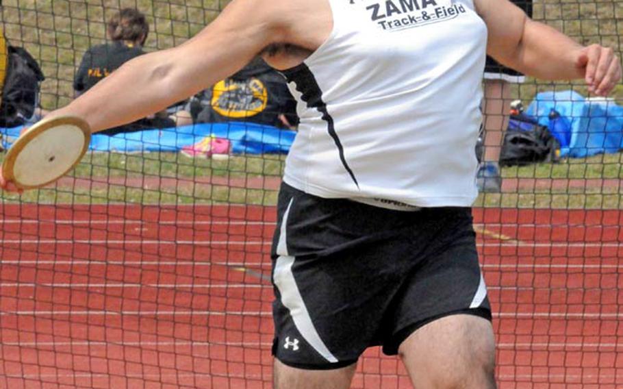 Zama American senior Roland Cote cuts loose in the discus Friday in the 9th Alva W. "Mike" Petty Memorial Track & Field Meet at Camp Foster, Okinawa. Cote broke the meet's six-year-old record of 41.2 meters by nearly two meters, throwing a 43.15, or 141 feet, 6 inches.