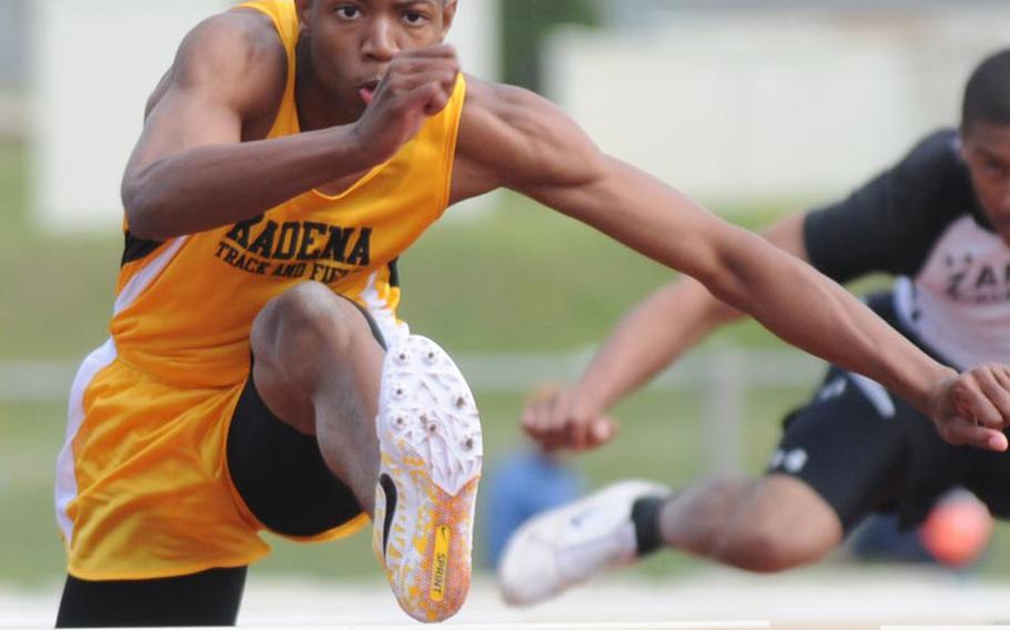 Kadena's Derrick Taylor negotiates the 110-meter hurdles during Saturday's running finals in the 9th Alva W. "Mike" Petty Memorial Track and Field Meet at Camp Foster, Okinawa. Taylor won the event in 15.77 seconds.