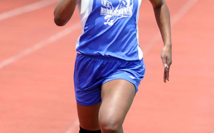 Seoul American Falcons sprinter Kelsey Scott races for the tape in the girls 1,600-meter relay during Saturday's running finals in the 9th Alva W. "Mike" Petty Memorial Track and Field Meet at Camp Foster, Okinawa. Scott and the Falcons were timed in 4 minutes, 22.05 seconds, breaking the eight-year-old meet mark of 4:24.4.