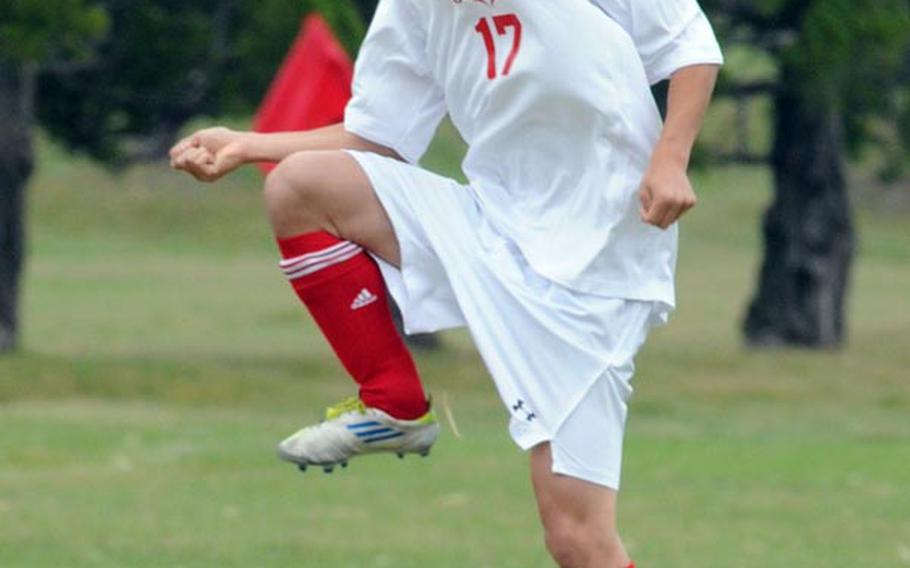 E.J. King's Daichi Bellwood readies to settle the ball against Matthew C. Perry during Saturday's DODDS Japan boys soccer match at Marine Corps Air Station Iwakuni, Japan. The host Samurai won 3-2 and later beat the Cobras 6-1 and 5-0.