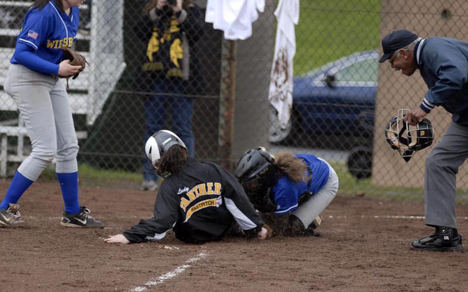 Wiesbaden sophomore catcher Victoria Myers tags out Patch senior Peyton Smith at the plate during the opening game of a Saturday doubleheader. Patch swept the matchups, remaining undefeated on the year.