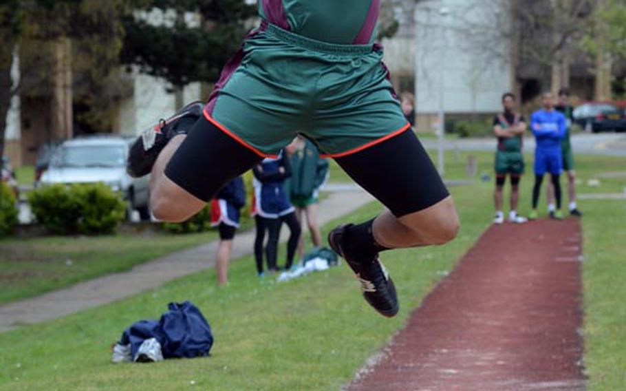 AFNORTH's Jamil Pollock, a senior, flies through the air on one of his long jump attempts during a track meet Saturday at RAF Lakenheath, England. Pollock's longest leap netted 18 feet, 6 inches and was enough for first place.