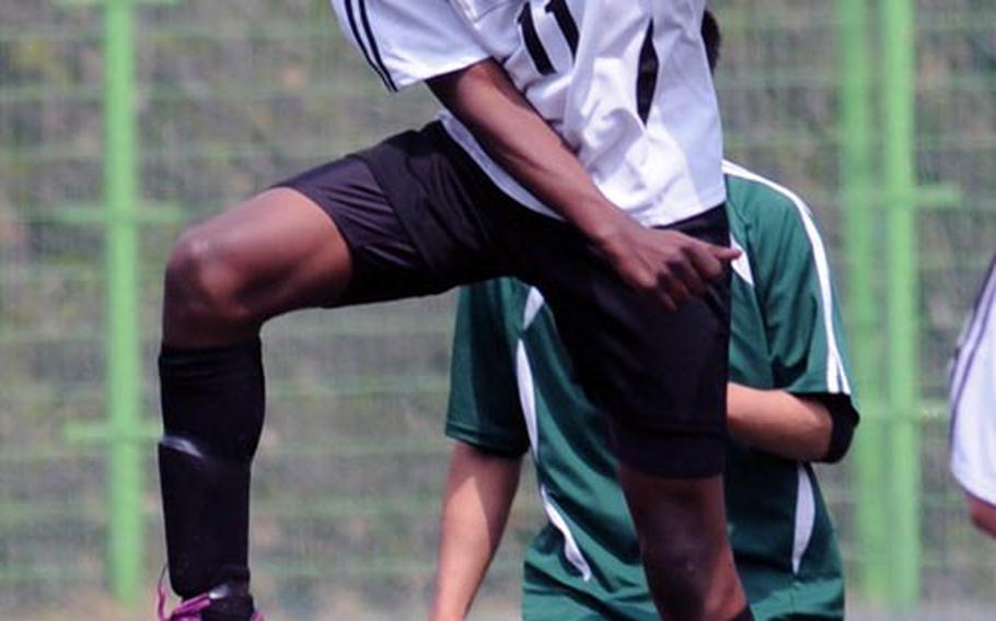 Menasseh Nartey of Osan American heads the ball against Daegu during Saturday's placement match in the Korean-American Interscholastic Activities Conference Boys Division I Soccer Tournament at Suweon, South Korea. The Cougars won 3-0. For Osan and Daegu, the KAIAC tournament is the last significant action they see until the Far East Division II Tournament May 21-25 at Camp Humphreys.