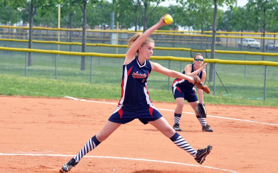 Aviano senior Lauren Cox fires a pitch toward home Saturday in the Saints' 7-4 victory over Vicenza in the the first game of a doubleheader. Cox struck out seven and allowed two hits in the victory.