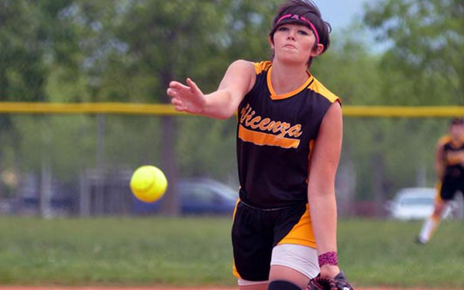 Vicenza freshman Megan Buffington watches one of her pitches fly toward home Saturday in a softball doubleheader at Aviano. Buffington threw all 14 innings on the day as the teams split, striking out 25 batters. But she also walked nine and uncorked nine wild pitches.