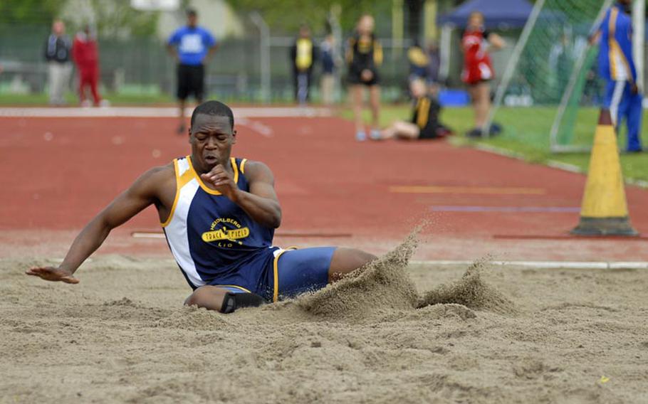 Heidelberg senior Wayne Dawkins makes a landing in the boys long jump compeition during an eight-team competition Saturday at Heidelberg. Dawkins won the event on Saturday with a long jump of 20 feet, 8 inches.