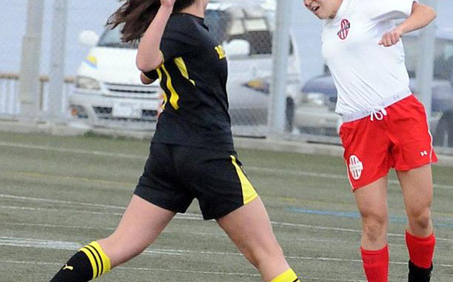 Nile C. Kinnick's Kaile Johnson heads the ball against American School In Japan's Isabella Loose during Friday's Kanto Plain Association of Secondary Schools girls soccer championship match at Yokosuka Naval Base, Japan. The host Red Devils blanked the Mustangs 1-0 for their first Kanto title since 2008 and their fifth in 13 seasons.