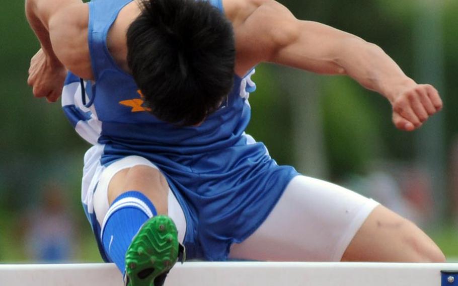 Yokota's Fred Gustafsson gives it all he has in the 110-meter hurdles during Saturday's Kanto Invitational track and field meet at Yokota Air Base, Japan. Gustafsson won in 14.93 seconds -- just the third athlete in Pacific history to run the event in under 15 seconds.