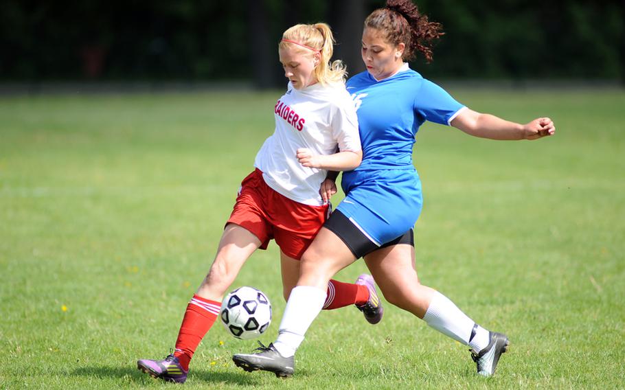 Kaiserslautern's Emily Crawford, left, and Ramstein's Sherree Simonson battle for the ball in a game of undefeated teams in Kaiserslautern, Saturday. Ramstein won 1-0 to take the Region II title going into the European championships that begin May 21.