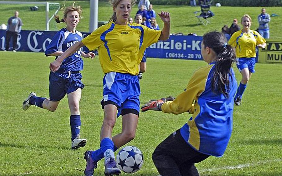 Wiesbaden junior Meghan Smith drives to the goal as Bitburg sophomore keeper Isabella Madamba positions herself for the save. The host Wiesbaden girls squad blanked Bitburg on Saturday, 4-0.