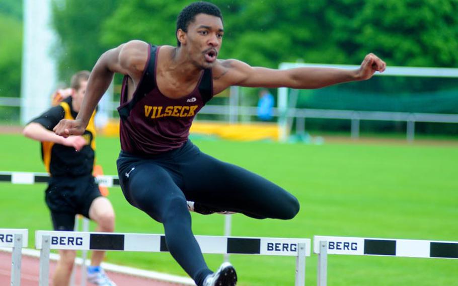 Vilseck's Renanzo Williams leads during the boys 100 meter hurdles Saturday at a track and field meet hosted by Patch.