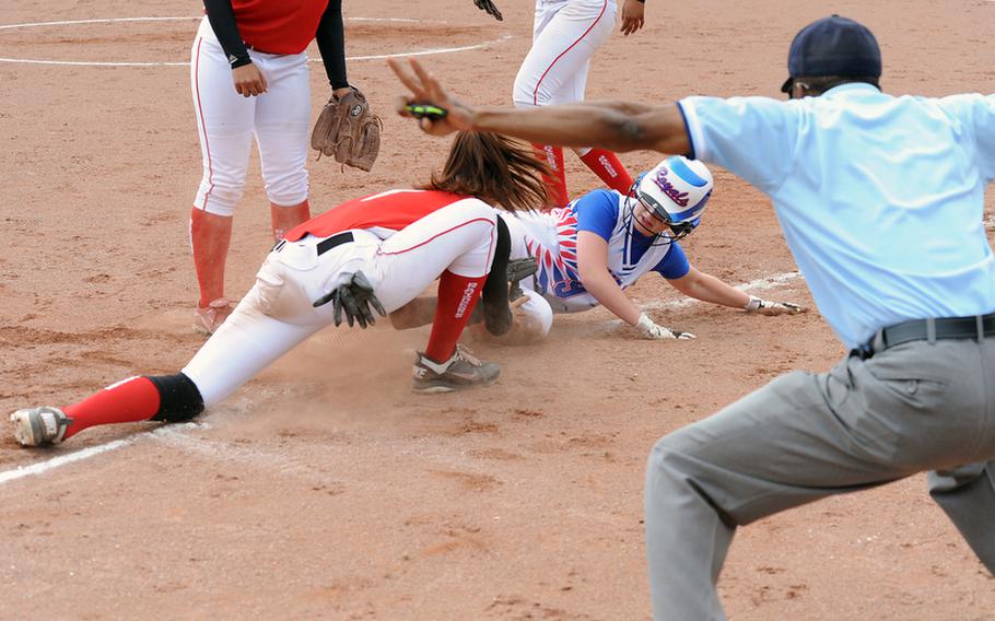 Ramstein's Lacee Loescher slides safely back into third before Kaiserslautern's Michelle Bonano can put on the tag. Kaiserslautern beat their cross-town rivals 1-0 in the first game of a doubleheader, to take the Western Region title.