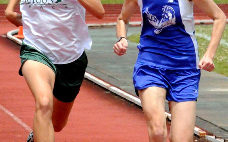 Kubasaki junior Allie Reichenberg and reigning two-time Far East cross-country champion Amanda Henderson of Seoul American pound for home in the 3,000-meter run in the 9th Alva W. "Mike" Petty Memorial Track & Field Meet at Camp Foster, Okinawa. Henderson edged Reichenberg 11:10.53 to 11:10.97. The two are expected to renew that rivalry at this week's Far East meet at Yokota High School.