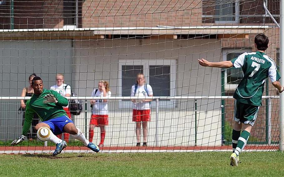 Hohenfels keeper Kevin White stops the penalty kick by AFNORTH's Beau Timmons to set up the winning shot by teammate Jordan Akalaonu. Hohenfels beat AFNORTH in the Division II game in a shootout after the game ended in a 1-1 tie.