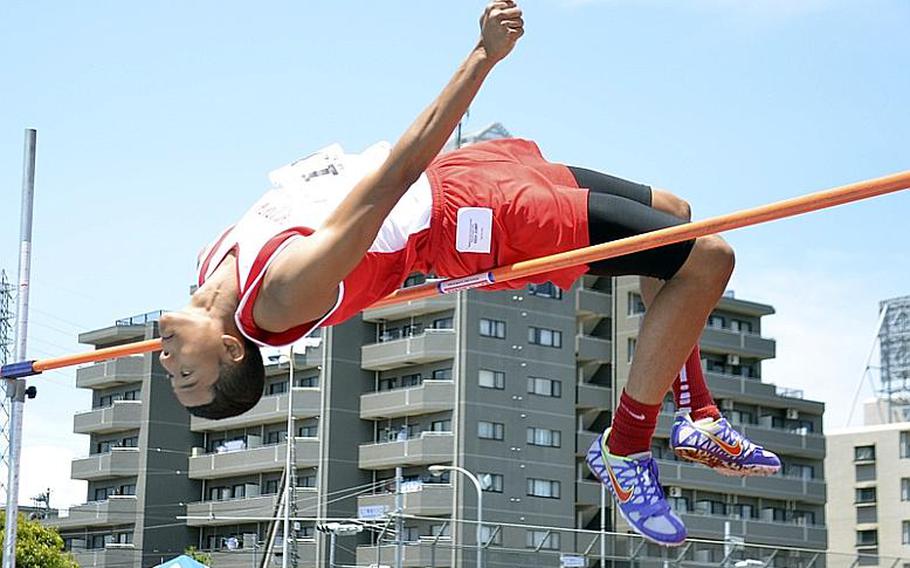 Justin Smith of Nile C. Kinnick clears the bar at 1.8 meters in the high jump during Wednesday's field-events portion of the 3rd Far East High School Track and Field Meet at Yokota Air Base, Japan. Smith finished second to Kenjo Maeji of American School In Japan.