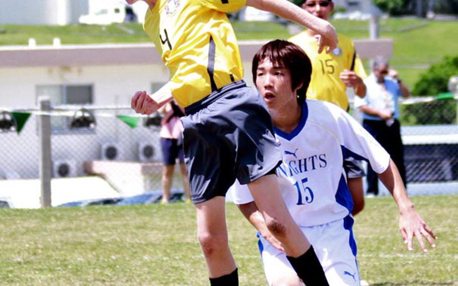 Ethan Russ of Guam High heads the ball in front of Christian Academy Japan's Shuhei Tanaka during Wednesday's pool-play match in the Far East High School Boys Division I Soccer Tournament at Camp Foster, Okinawa. CAJ beat the Panthers 3-1.