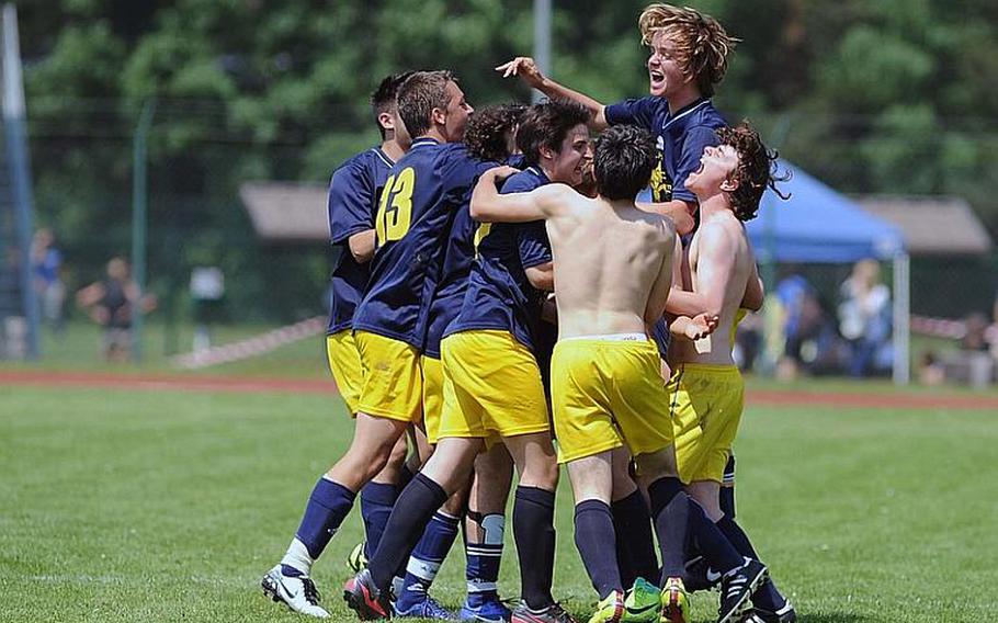 The Florence boys celebrate their Division III title at the DODDS-Europe soccer championships after defeating Rota 3-0.