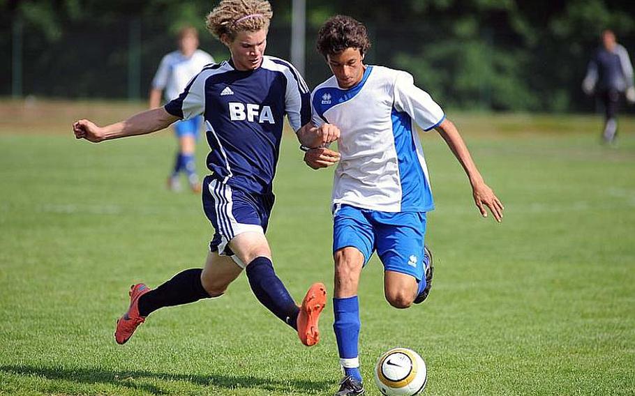 Black Forest Academy's Michael Peters, left, defends against Marymount's Raffaele Bevilacqua in the Division II final at the DODDS-Europe soccer championships. Marymount won 1-0.