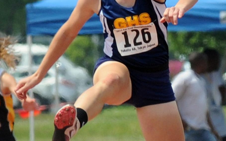 Guam High senior Stefani Loisel clocks the 300 hurdles in a Pacific-record 46.97 seconds during Thursday's final in the Far East High School Track and Field Meet at Yokota Air Base, Japan. She also broke her meet record of 47.48 seconds set the day before in preliminaries.