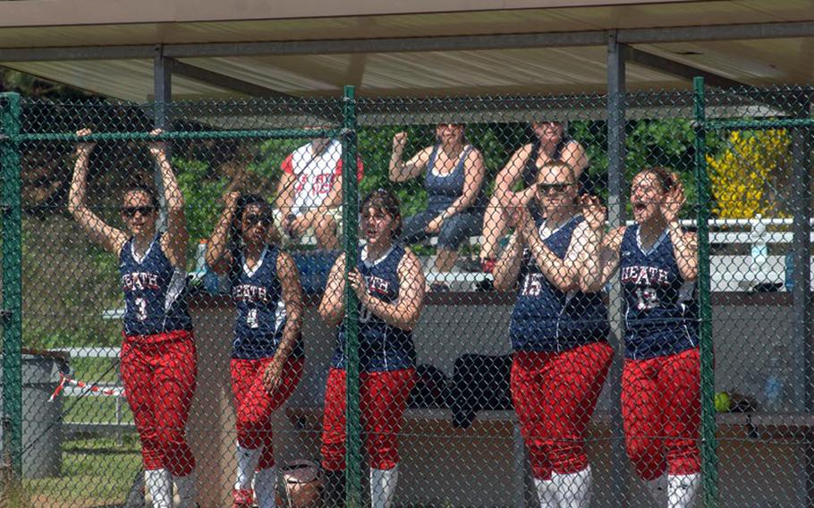 Lakenheath High School softball players line the dugout fence during Thursday's 12-1 loss to Patch, part of opening pool play in the European high school championships at Ramstein High School.