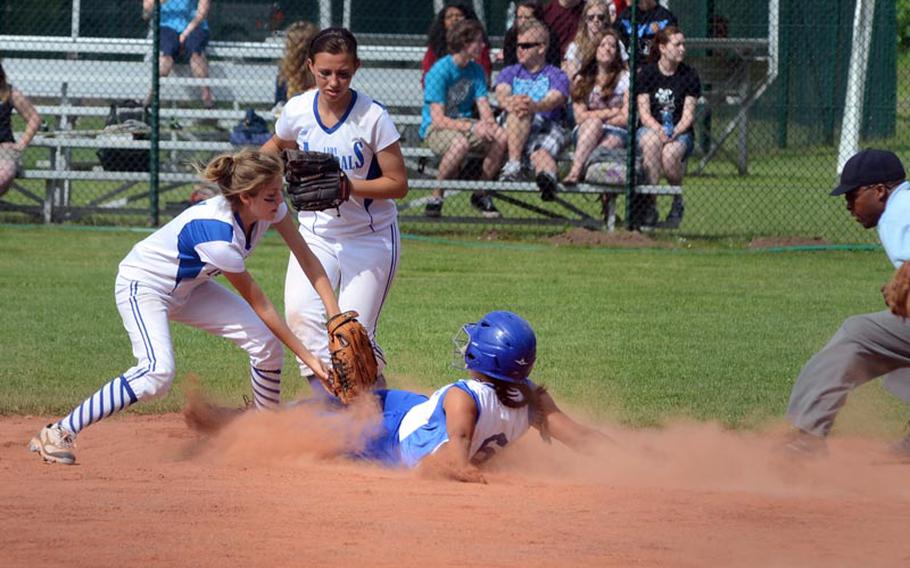 Rota shortstop Katlyn Eastin tags Bamberg's Aisha Schenk out at second base while Anastasia Bienvenue provides backup, Friday, during the second day of action in the DODDS-Europe softball championship from Ramstein Air Base in Germany.  Rota won 16-12.