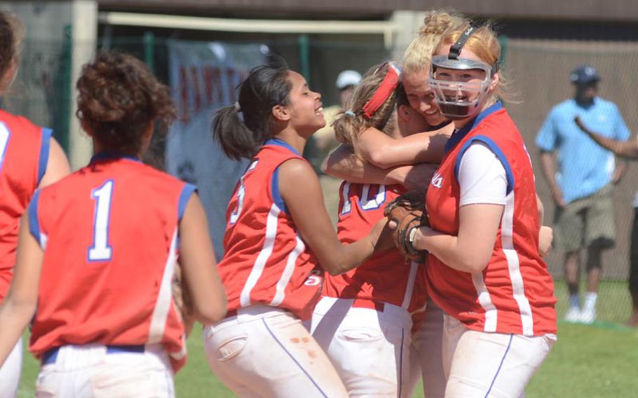 The DODDS-Europe Division I softball champions Ramstein Royals celebrate Saturday after defeating Vilseck 9-5 at Ramstein Air Base in Germany.