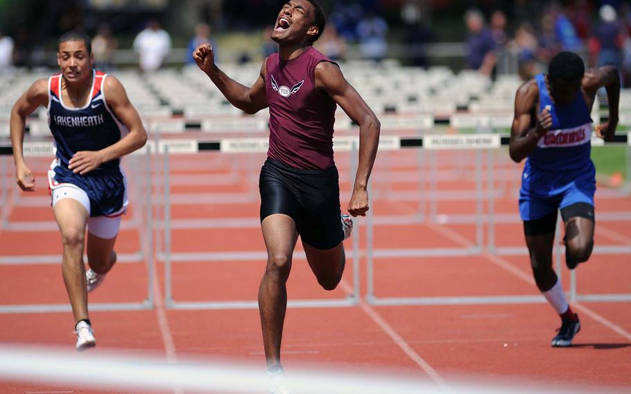 Vilseck's Renanzo Williams reacts to winning the 110-meter hurdles in 16.07 seconds. At left is Lakenheath's Keenan Couture, who finished third, and at right is Michael Johnson of Ramstein, who was fourth.