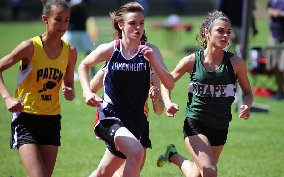 SHAPE's Mishal Cotugno, right, leads Lakenheath's Uria Thomas and Patch's Julia Lockridge into the final lap in the 800-meter race. Cotugno won in 2 minutes 22.93 seconds. Lockridge was second and Thomas seventh.