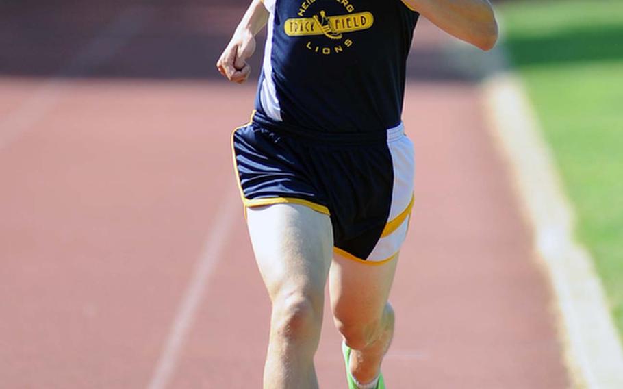 Brian Hannum sprints to the finish line to win the 3,200-meter race at the DODDS-Europe track and field championships in Russelsheim, Germany, Saturday. Hannum won in 9 minutes 53.68 seconds, ahead of Michael Lawson and Sean Davis of Kaiserslautern.