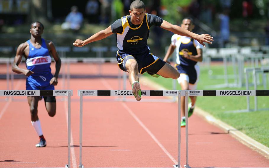 David Hoke of Heidelberg won the 300-meter hurdles in 40.45 seconds. At left is Ramstein's Michael Johnson, who was third,