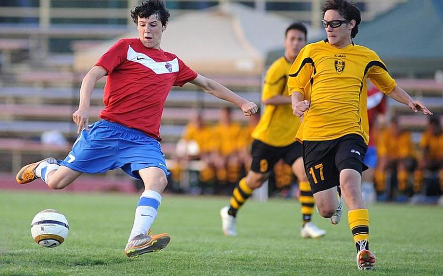 ISB's Alessandro Pryce gets ready to shoot past Patch's Randall Miks in the Division I final at the DODDS-Europe soccer championships. Pryce has been named Stars and Stripes boys Athlete of the Year for soccer.