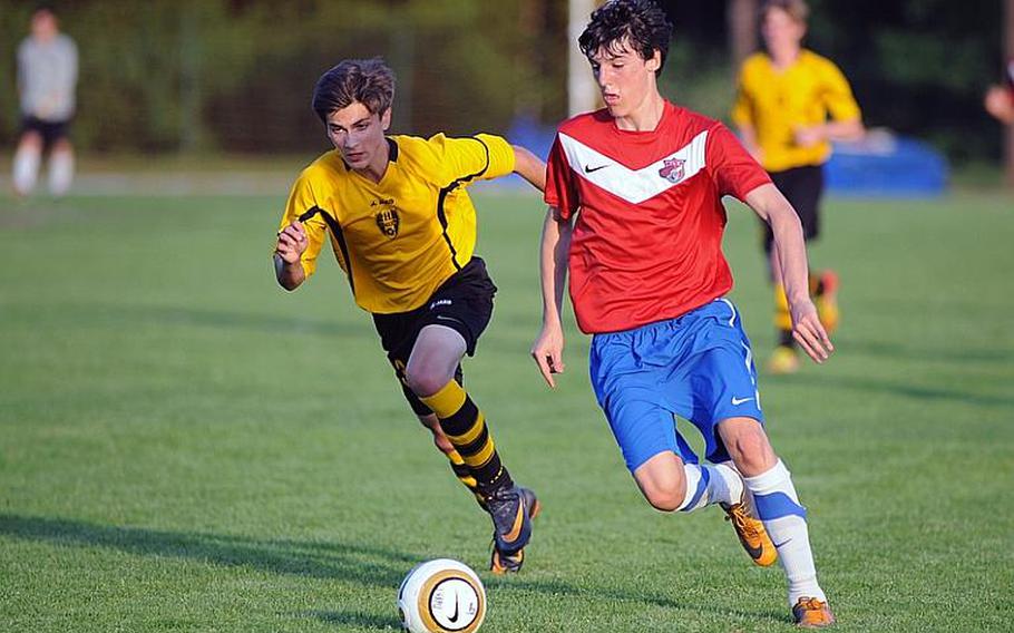 ISB's Alessandro Pryce drives the ball upfield against Patch's Jacob Lindman in the Division I final at the DODDS-Europe soccer championships. Pryce has been named Stars and Stripes boys Athlete of the Year for soccer.