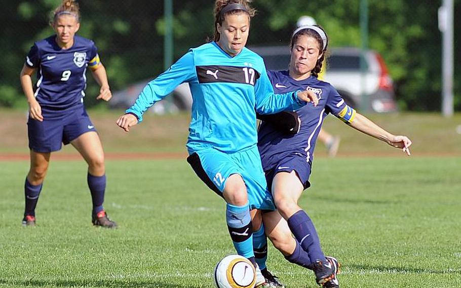 Patch's Emma Murray protects the ball from Ramstein's Josie Seebeck during the Division I final at the DODDS-Europe soccer championships in May. Murray has been named Stars and Stripes girls Athlete of the Year for soccer.