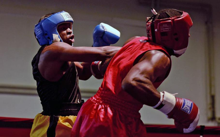 Jerrola Jackson connects with a right to the chin of Jermaine O'Neal in their light heavyweight bout Saturday night during the Installation Management Command Boxing Invitational at Miesau Army Depot, Germany.