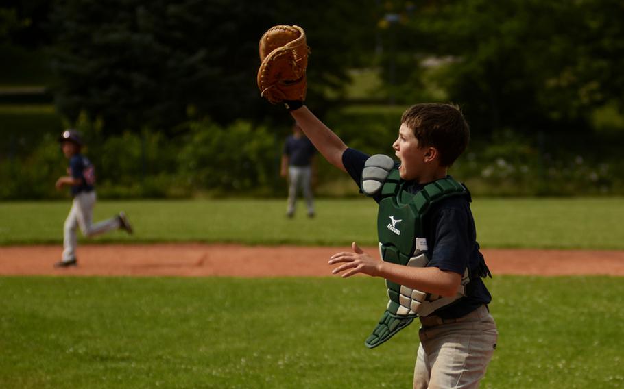 Nick Notgrass, catcher for the 11-12 year-old All-Stars, calls for the ball during Thursday's practice at Ramstein Air Base.