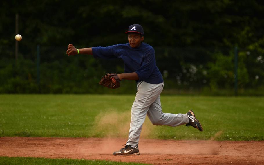 Tyler Woodberry, first baseman for the 11-12 year-old All-Stars, whips the ball to third base during Thursday's practice at Ramstein Air Base.