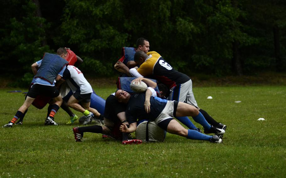 The Ramstein Rogues rugby team runs drills during a recent practice at Ramstein Air Base.