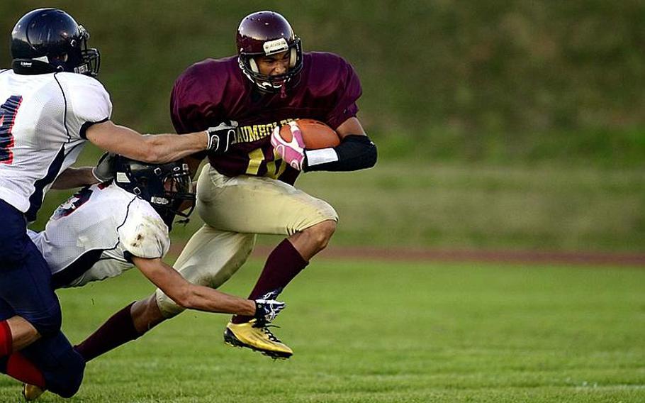 Baumholder's Ben McDaniels breaks a tackle in a game against Bitburg last year.