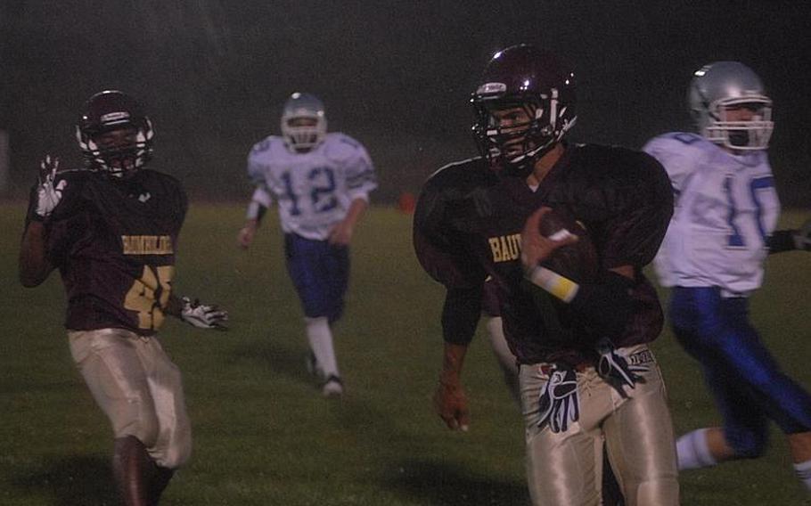 Baumholder workhorse Ben McDaniels sprints for the end zone Friday during the Bucs homecoming game against Brussels. Baumholder won the game 57-6.