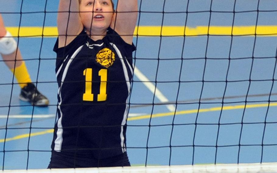 Heidelberg's Emma Roberts goes up to attempt a block against Vilseck's Sidni Beaulieu-Hains in a match in Heidelberg last year.