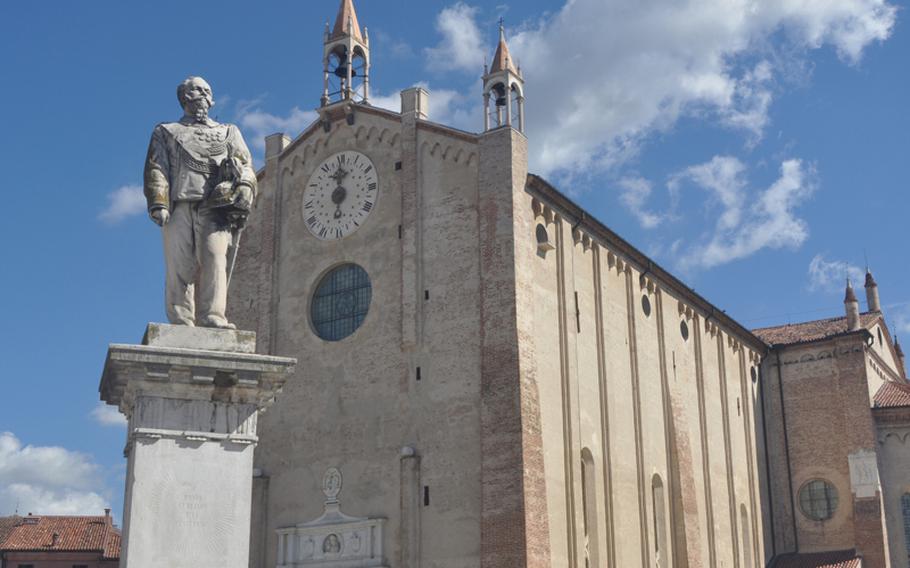 A statue of Vittorio Emanuele II sits in the main square named after him in the city of Montagnana, Italy, with the Duomo di Santa Maria Assunta facing one side. Vittorio Emanuele II was king of Italy in the late 1800s and considered one of the founders of the modern Italian state.