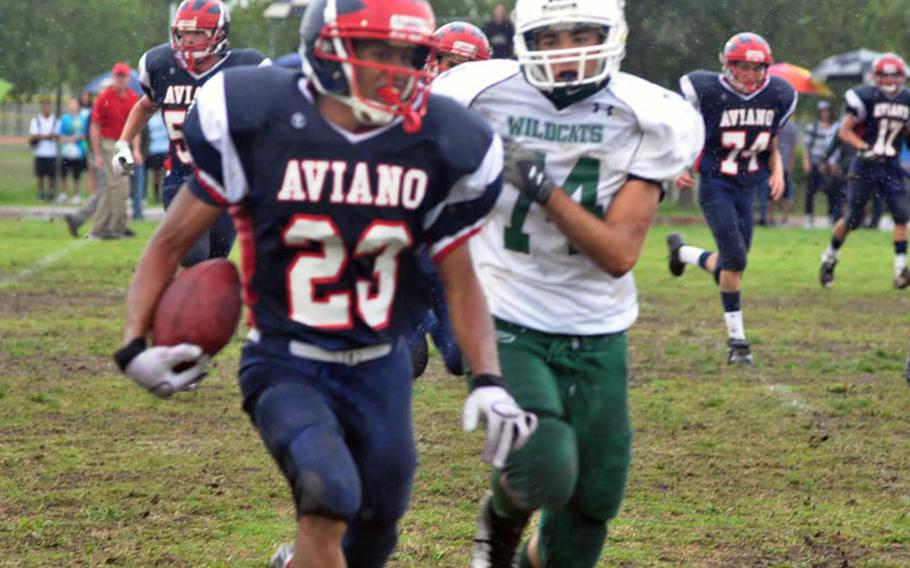 Aviano's Andrew Bert is chased by Naple' Zack Cheek Saturday after making an interception. Cheek would  get an interception of his own a few minutes later and run it back for a touchdown to send the Wildcats on their way to a 41-0 victory.