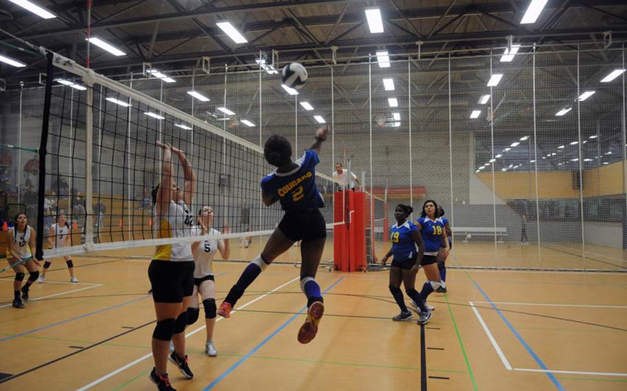 Ansbach's Caprice Lockett leaps to spike the ball during a game against Patch on Saturday at Patch High School.