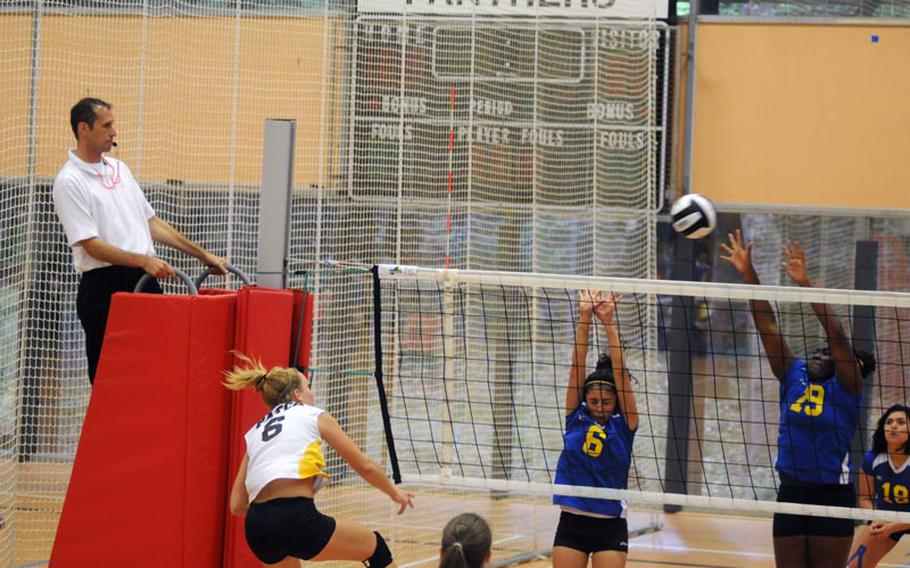 Ansbach's Jasmine Rodriguez, center, and Adreana Cunningham attempt to defend a spike from Patch's Rachel Hess during a game Saturday at Patch High School.